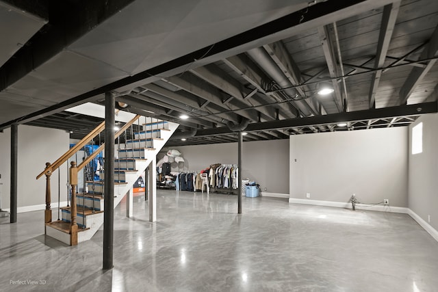 stairway featuring concrete floors