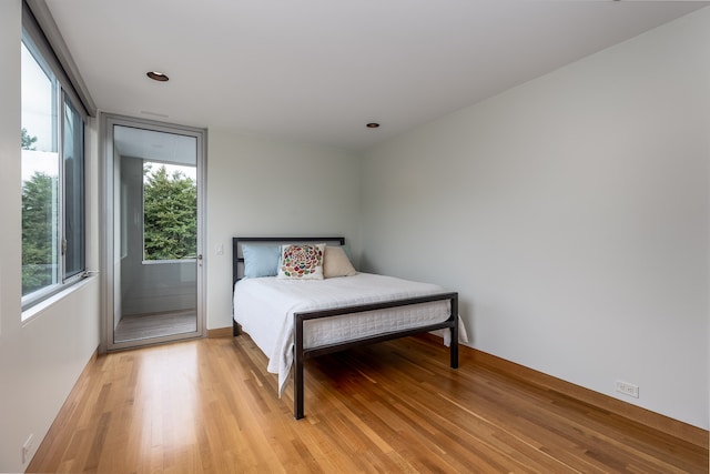 bedroom with light hardwood / wood-style floors