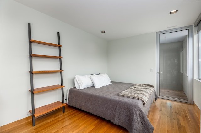 bedroom with light hardwood / wood-style floors