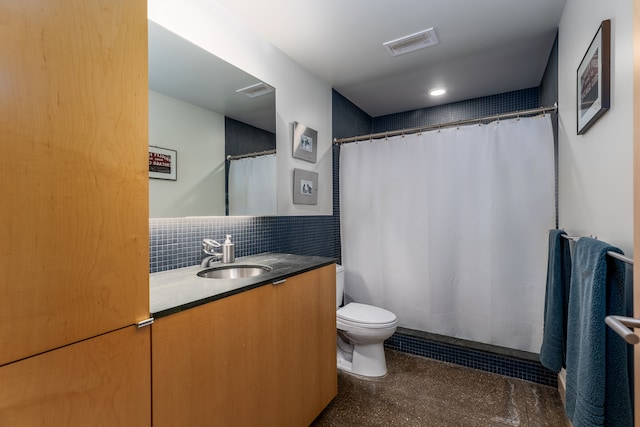 bathroom with decorative backsplash, walk in shower, vanity, and toilet