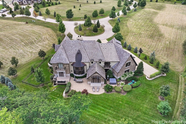 birds eye view of property featuring a rural view