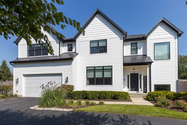 view of front of property with a garage