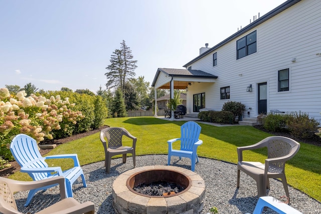 view of patio / terrace featuring an outdoor fire pit