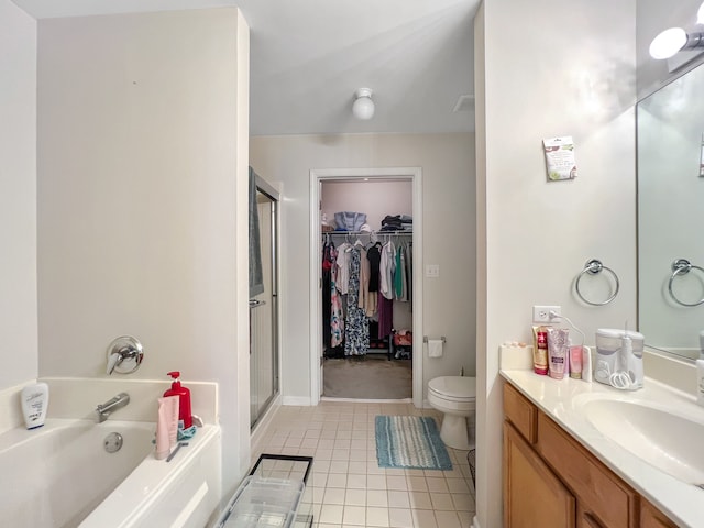 full bathroom featuring vanity, toilet, tile patterned floors, and shower with separate bathtub