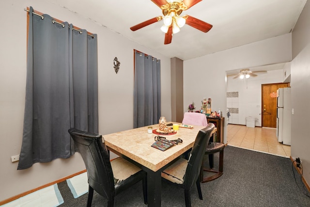 tiled dining room with ceiling fan