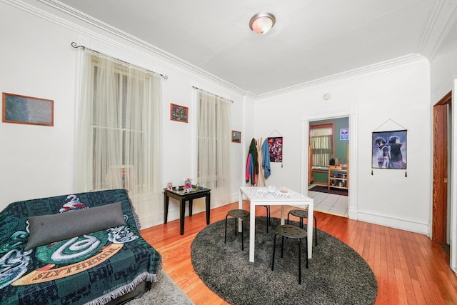 interior space featuring ornamental molding and light hardwood / wood-style flooring