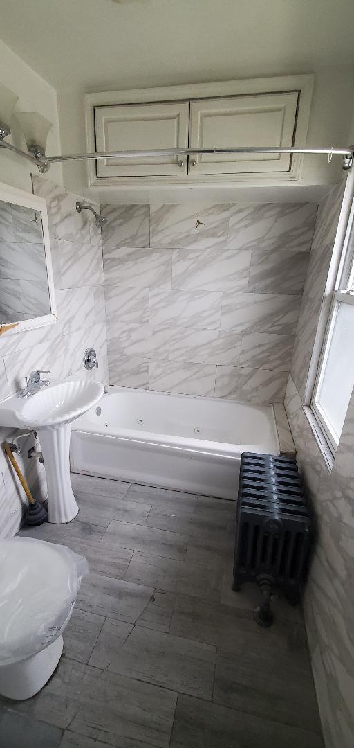 bathroom with shower / bathing tub combination