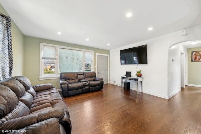 living room with dark hardwood / wood-style floors