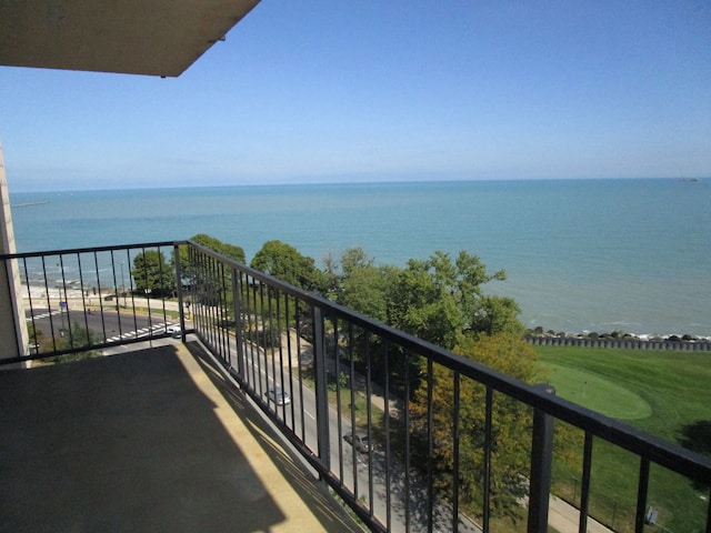 balcony featuring a water view