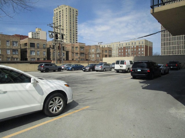 6730 S S Shore Dr Unit 1001, Chicago, IL 60649 - uncovered parking lot featuring a city view