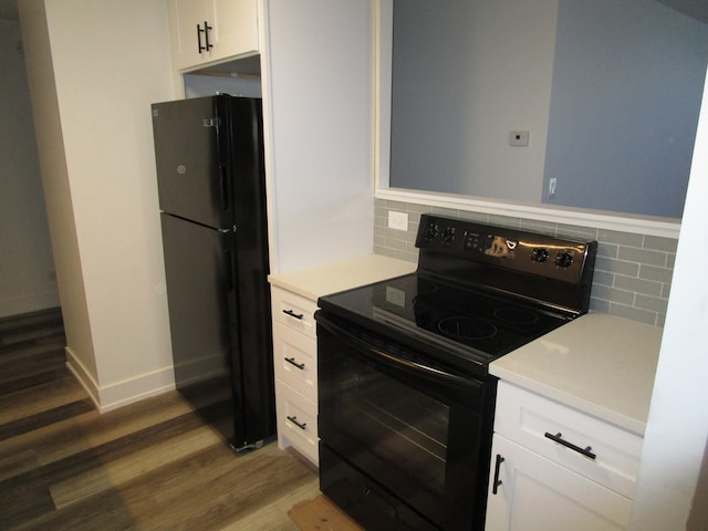 kitchen with white cabinetry, tasteful backsplash, and black appliances