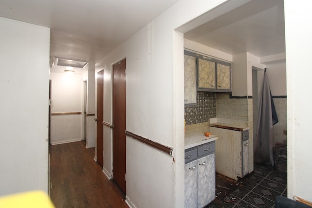 corridor with dark hardwood / wood-style floors