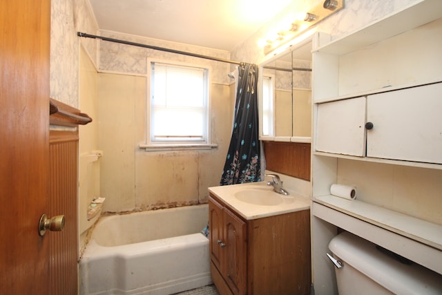 full bathroom featuring vanity, toilet, and shower / tub combo