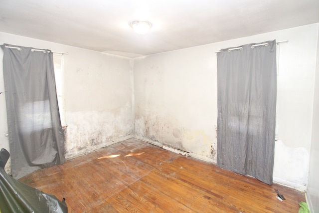 empty room featuring hardwood / wood-style flooring