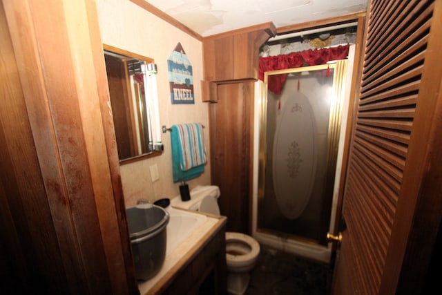 bathroom with vanity, toilet, and ornamental molding