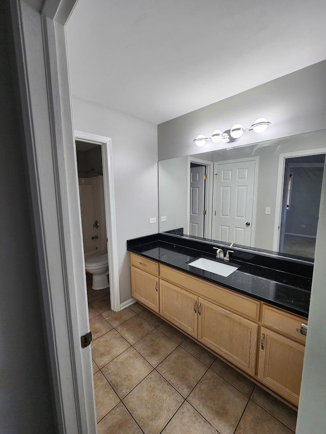 full bathroom with toilet, bathtub / shower combination, vanity, and tile patterned floors