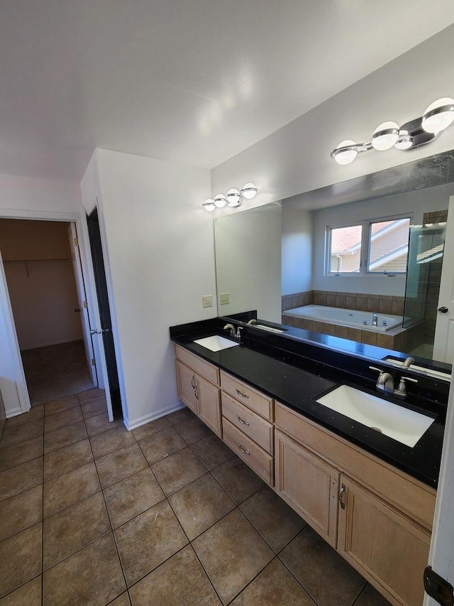 bathroom with a stall shower, a sink, a whirlpool tub, and double vanity