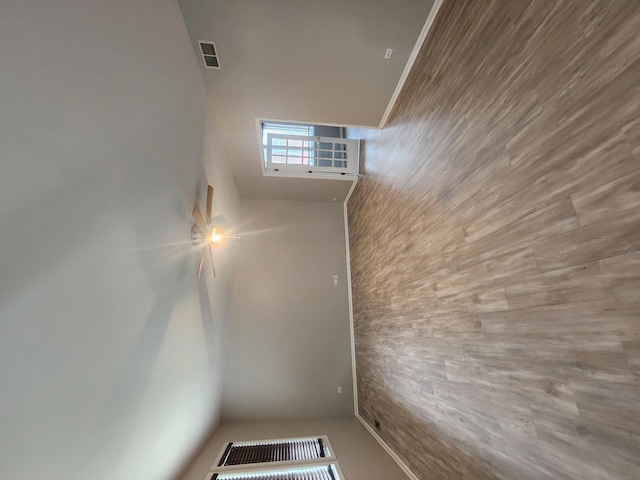 unfurnished room with a high ceiling and visible vents