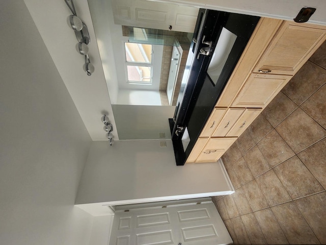 kitchen featuring light brown cabinets