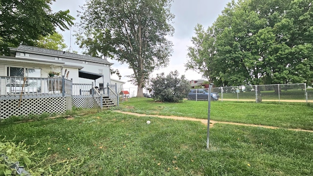 view of yard featuring a wooden deck