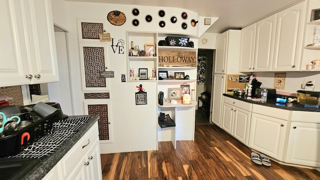 kitchen featuring white cabinetry and dark hardwood / wood-style flooring