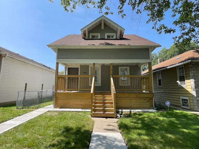 bungalow-style house with a front yard and a porch