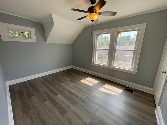 bonus room featuring plenty of natural light, dark wood-type flooring, and ceiling fan