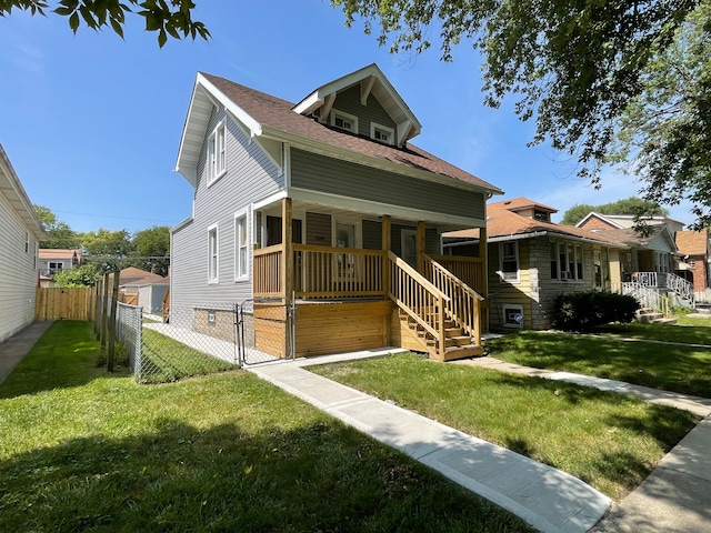 bungalow-style house with a front yard and a porch