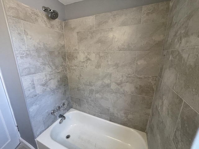 bathroom with washtub / shower combination