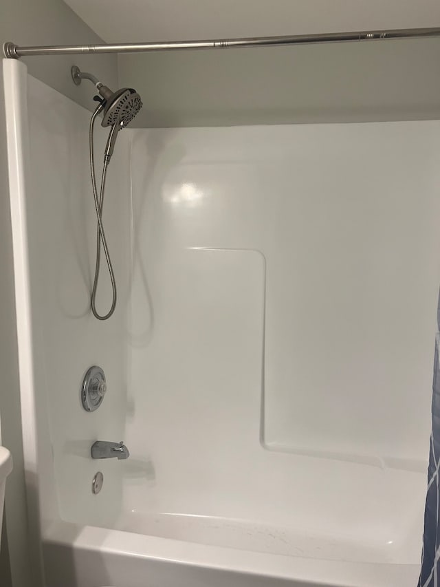 bathroom featuring  shower combination