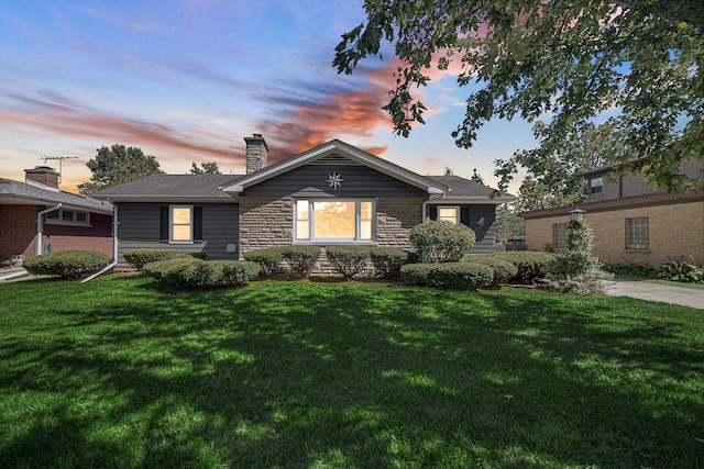 view of front of house with a lawn