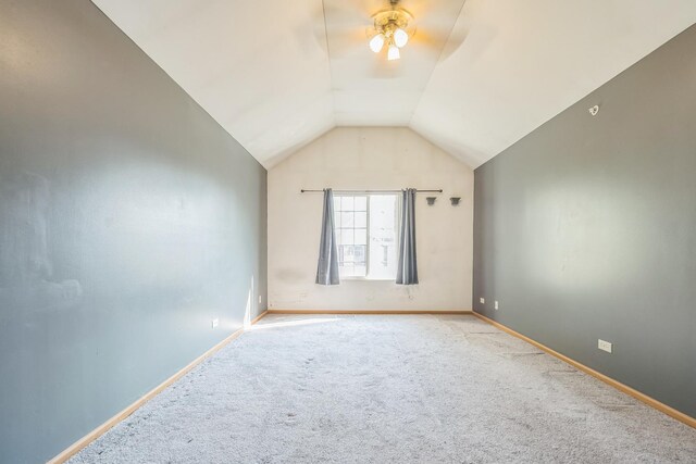 bonus room with lofted ceiling, light colored carpet, and ceiling fan