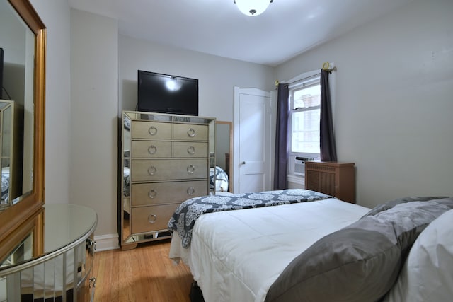 bedroom with light wood-type flooring