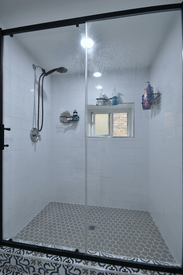 bathroom with a shower with shower door