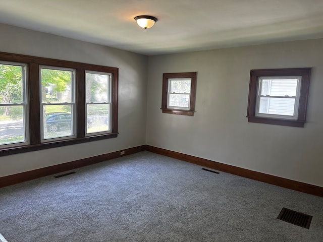 spare room featuring carpet