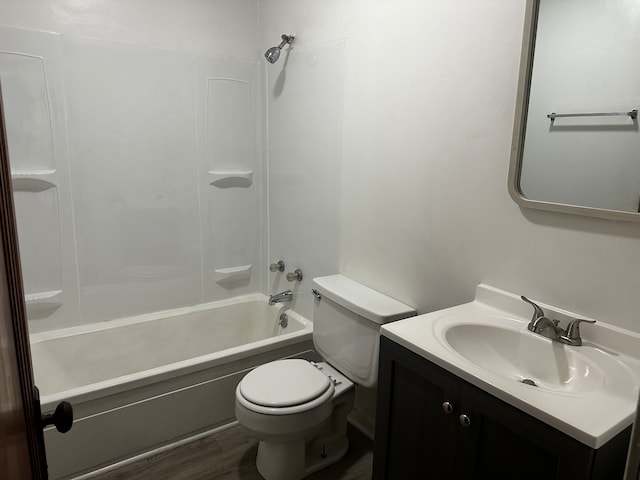 full bathroom with vanity, toilet,  shower combination, and hardwood / wood-style flooring