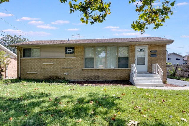 ranch-style house with a front yard