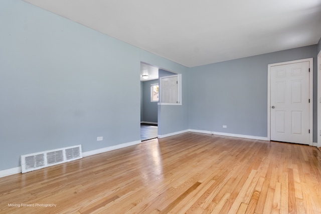 empty room with light hardwood / wood-style floors