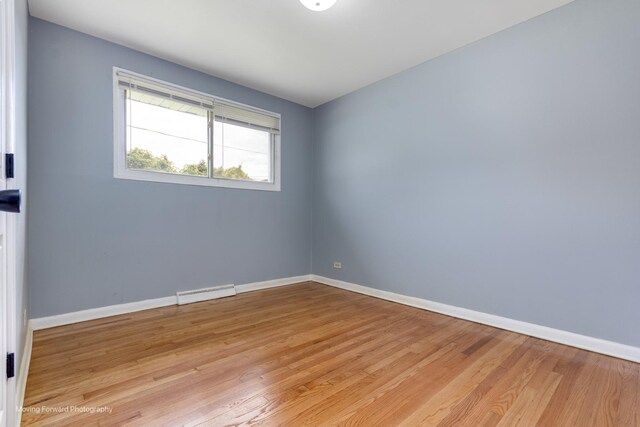 empty room featuring wood-type flooring