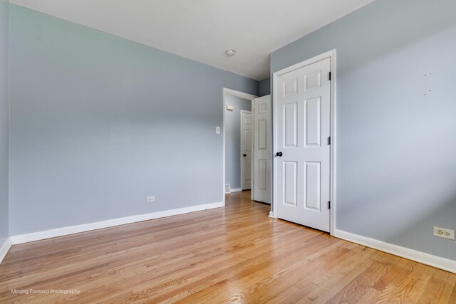 spare room with light hardwood / wood-style flooring