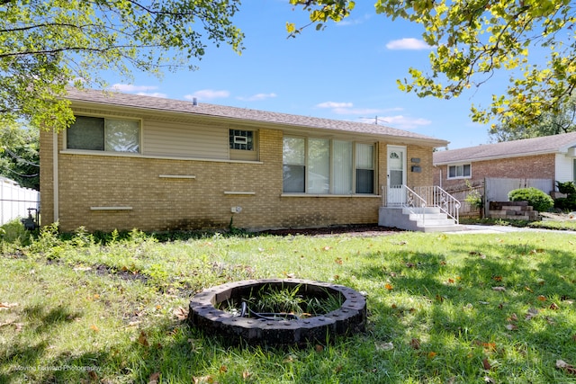 ranch-style home with a front yard