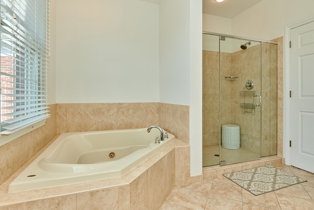 bathroom featuring a healthy amount of sunlight, plus walk in shower, and tile patterned floors