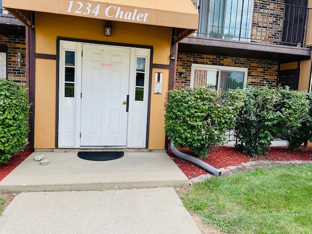 property entrance with a balcony