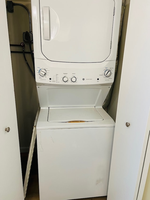 laundry room featuring stacked washer and clothes dryer