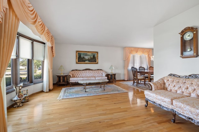 living room with light wood-type flooring and a wealth of natural light