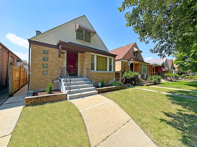 bungalow-style home with a front lawn