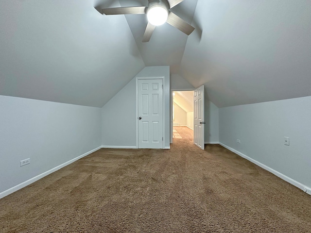 bonus room with lofted ceiling, carpet flooring, and ceiling fan