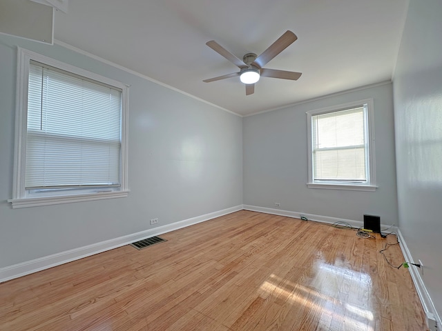 unfurnished room with ceiling fan, ornamental molding, and light wood-type flooring