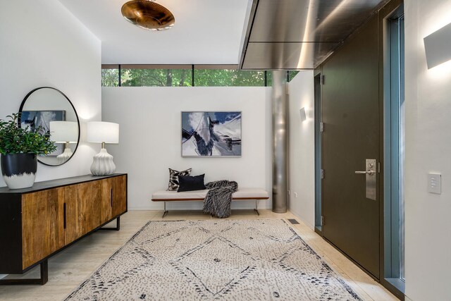 hallway with light hardwood / wood-style flooring