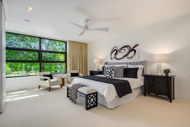 bedroom featuring ceiling fan and light colored carpet